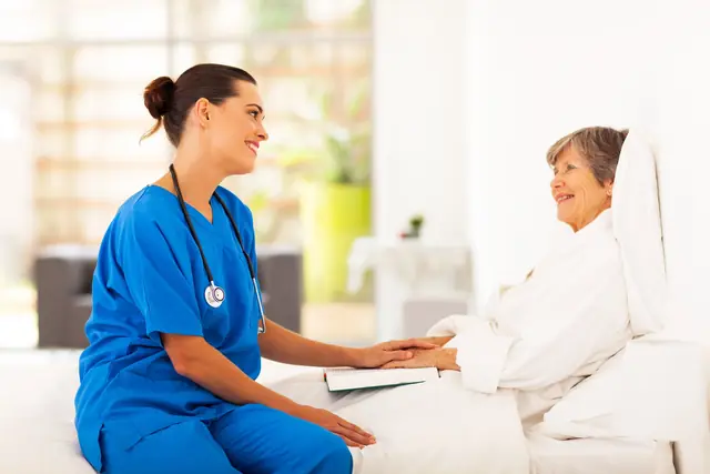 Home Caregiver Nurse Visiting Senior Patient 640