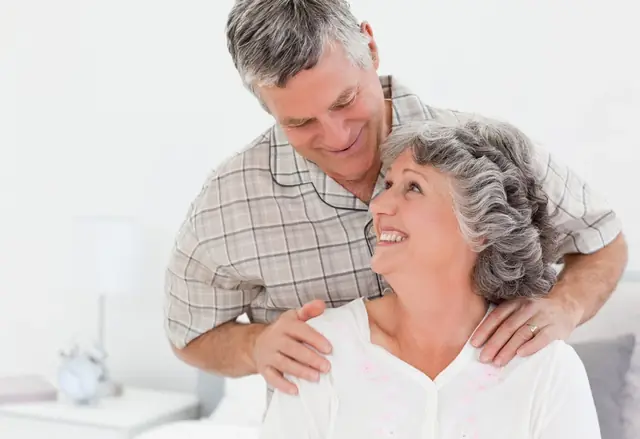 Why Choose Us An older couple smiles together at home