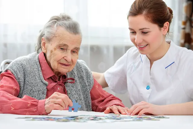 Home Senior Woman With Her Caregiver 640