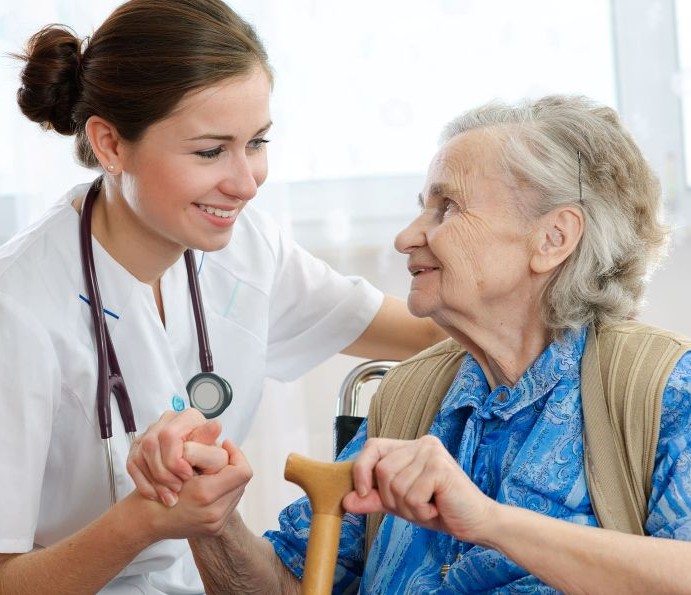 caregiver nurse help to senior lady