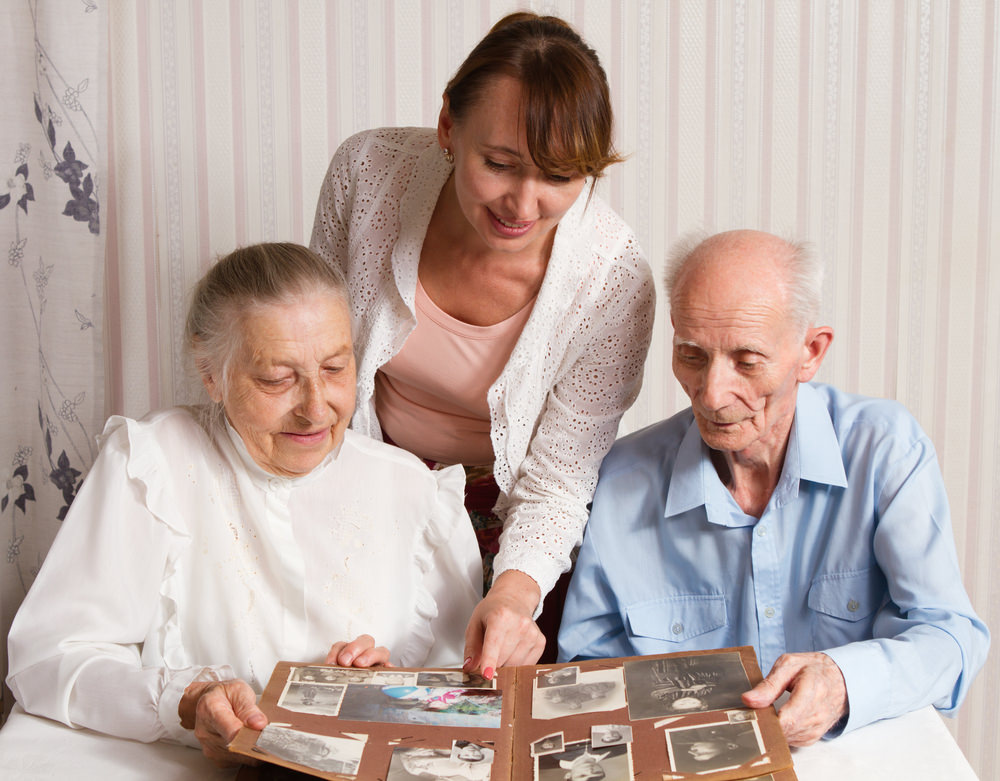Senior Man, Woman with their Caregiver at Home. Concept of Health Care for Elderly Old People, Disabled